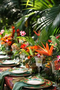 a long table with plates and flowers on it