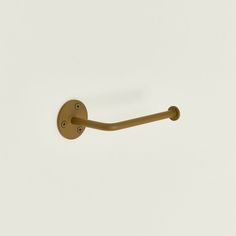 a brown handle on a white wall