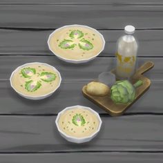 three bowls of soup on a wooden table next to a bottle of milk and an artichoke