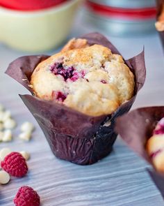 raspberry muffins in wrappers on a table