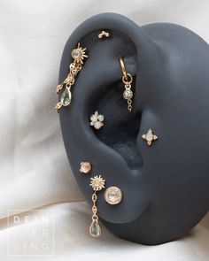 the earring is on display with other jewelry