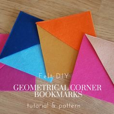 four different colored paper pieces with the words felt diy geometric corner bookmarks