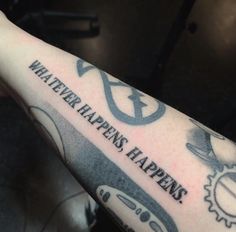 a person with a tattoo on their arm that says whatever happens