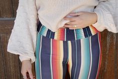 Fall In Love With Serape Bell Pants! Serape Bell Pants with Smocking Waistband 95% Polyester 5% Spandex S (4-6) M (6-8) L (8-10) XL (10-12) Festival Stretch Bottoms With Elastic Waistband, Fitted Casual Pants For Festival, Casual Fitted Pants For Festival, Fun Stretch Bottoms With Elastic Waistband, Casual Fitted Bottoms For Festival, Casual Stretch Pants With Waistband, Multicolor Elastic Bottoms For Spring, Multicolor Stretch Casual Bottoms, Elastic Multicolor Bottoms For Spring