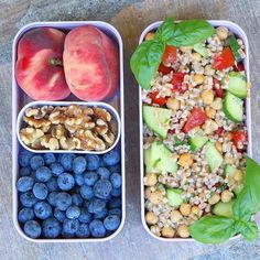 two plastic containers filled with food next to blueberries and peaches on a table