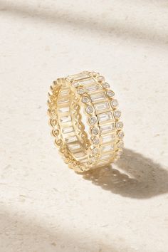 Eternity rings are a long-heralded symbol of never-ending love, and Sydney Evan's version is incredibly beautiful. Cast from 14-karat gold, it's set with continuous lines of sparkling baguette-cut diamonds surrounded by bezel-set, round-cut versions. It's housed in a designer-stamped box, rounding out the perfect gift to celebrate a milestone or anniversary. Elegant Stackable Emerald-cut Eternity Band, Dazzling Gold Eternity Band Gift, Elegant 14k Gold Eternity Band With Halo, Gold Infinity Eternity Band For Anniversary, Elegant Gold Halo Stackable Rings, Elegant Halo Eternity Band In 14k Gold, Luxury Gold Stackable Rings Channel Set, Luxury Gold Stackable Rings With Channel Set, Gold Luxury Stackable Rings With Channel Set