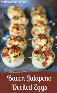 bacon and cheese deviled eggs on a glass platter