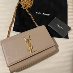 Authentic Ysl Kate Small In The Color Dark Beige. This Beautiful Date Night/Casual Occasion Purse Is In Brand New Condition!!! No Scratches Or Damages. Wore 3-4 Times Since Bought Within In A Few Months Ago. It Has A Gold Chain And Comes With A Dust Bag. Please Feel Free To Message Me With Any Inquiries Regarding The Bag :) Ysl Kate Bag Beige, Ysl Kate Suede Bag, Ysl Kate Small Silver, Yves Saint Laurent Bag Beige, Ysl Kate Bag, Ysl Kate, Kate Bags, Beige Bag, Yves Saint Laurent Bags