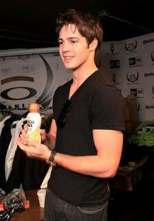 a young man holding a jar of peanut butter