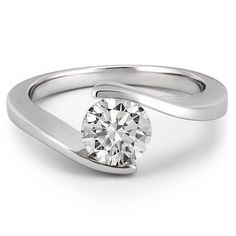 a white gold ring with a single diamond in the center and a curved band around it