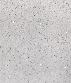 a white and black speckled surface with small dots