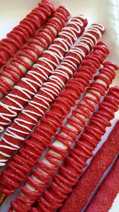 red and white desserts are arranged on a plate