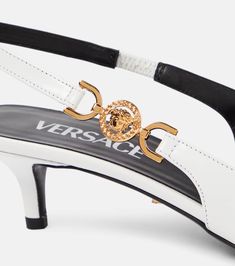 Find VERSACE Medusa Biggie Leather Slingback Pumps on Editorialist. Upper: calf leather. Lining: leather. Sole: leather insole and sole. Toe shape: square toe. Made in Italy. Includes: shoe box, dust bags. Designer color name: Optical White-Versace. Luxury Calf Leather Ankle Strap Slingback Sandals, Designer Leather Slingback Pumps With Branded Heel, Designer Leather Slingback Pumps With Heel Strap, Luxury Calf Leather Slingback Sandals, White Calf Leather Slingback Pumps For Evening, Classic White Calf Leather Slingback Pumps, Luxury Slingback Sandals With Pointed Toe, Luxury High Heel Slingback Sandals With Leather Sole, Luxury Calf Leather Slingback Sandals With Ankle Strap