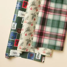 four different patterns of fabric on top of each other, all in green and red