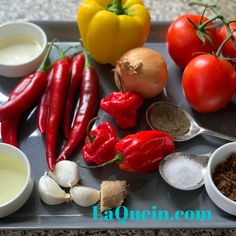 the ingredients are on the tray ready to be used in this recipe, including tomatoes, garlic, and peppers