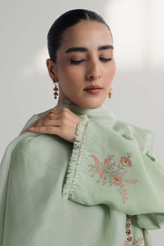 TOP:- Raw SilkBOTTOM:- Raw SilkDUPATTA:- OrganzaOur pastel green silk shirt features floral motifs in block print, embellished with gota work. This handcrafted ensemble is paired with an organza dupatta featuring floral ralli and embroidered accents.Disclaimer: Minor variations in these ensembles are intrinsic to the process of creating handcrafted products and add to their appeal. Embroidered Green Palazzo Set With Straight Kurta, Green Embroidered Palazzo Set With Straight Kurta, Green Chikankari Embroidery Anarkali Set, Embroidered Green Cotton Silk Anarkali Set, Pista Green Chanderi Salwar Kameez With Floral Embroidery, Green Chanderi Palazzo Set With Chikankari Embroidery, Green Anarkali Palazzo Set With Floral Embroidery, Green Cotton Silk Kurta With Chikankari Embroidery, Green Embroidered Chanderi Palazzo Set