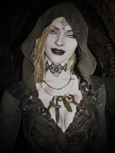 a woman with tattoos and piercings on her chest wearing a hoodie in a cave