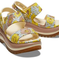 Retro Floral Print Unique 2.4-Inch / 6.13cm Height, Measured From Floor To Heel Rest Two-Strap Upper And Secure Backstrap Updated, Enhanced Rubber Tread Textured Detailing Around The Heel, Toe Box And Collar Customizable With Jibbitz Charms Iconic Crocs Comfort: Lightweight. Flexible. 360-Degree Comfort. Yellow Sandals With Heel Strap And Round Toe, Yellow Heel Strap Sandals For Summer, Summer Yellow Platform Heels, Yellow Flat Platform Sandals, Yellow Synthetic Wedge Heel Sandals, Yellow Synthetic Wedge Sandals With Ankle Strap, Yellow Synthetic Ankle Strap Wedge Sandals, Yellow Heel Strap Wedge Sandals For Summer, Casual Yellow Wedge Sandals With Cushioned Footbed