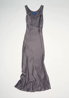 A heavenly yet understated floor length satin dress with low front scoop neckline and panelling throughout creating perfect drape.    material    81% triacetate 19% polyester    color    slate    size    product measurements: bust waist hip length    xs: 31.10 25.98 35.43 58.27    s: 33.07 27.95 37.40 58.27    m: 35.04 29.92 39.37 58.27    l: 37.01 31.89 41.34 58.27    xl: 38.98 33.86 43.31 58.27    origin    made in melbourne australia Permanent Vacation, Black Tank Dress, Black Aviators, Neon Purple, Vacation Dresses, Mid Dresses, Engineered Garments, Melbourne Australia, Ruched Dress