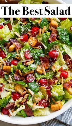 a salad with cranberries, almonds and lettuce