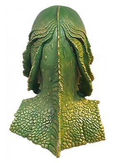 a green sculpture with leaves on it's head