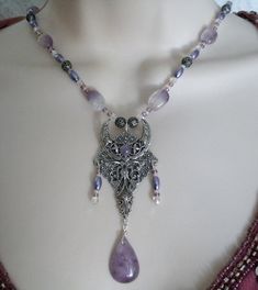 "This beautiful necklace has amethyst beads, Czech glass beads, pearl beads, seed beads, sterling silver plated filigree beads, sterling silver plated filigree crescent moon pendant with amethyst setting and a beautiful amethyst drop. 18\" long. Sterling silver plated toggle clasp." Mystical Purple Necklace For Festivals, Beaded Amethyst Pendant Jewelry, Amethyst Beaded Pendant Jewelry, Mystical Handmade Purple Necklace, Handmade Mystical Purple Necklace, Mystical Silver Amethyst Necklaces, Mystical Purple Jewelry For Festivals, Gothic Amethyst Necklace Gift, Mystical Amethyst Necklaces For Festivals