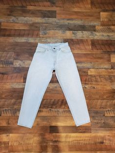 "Super beautiful light blue wash Jean, tapered leg. This are very rare. Brand: Levi's 550 Made in the USA Tag Size: 33 x 30 Measurements Waist: 30\" Hips: 42\" Rise: 11.5\" Inseam: 29.5\" Length: 39.5\" Condition: Great vintage condition well worn jeans. Size Chart to follow: 24\" Waist- US 0 25\" Waist - US 0 26\" Waist - US 2 27\" Waist - US 2 28\" Waist - US 4 29\" Waist - US 4 30\" Waist - US 6 All Sales are final. No returns , exchanges or cancellations on orders. Please review shop policie Worn Jeans, Clarksville Tn, Levis 550, Beautiful Lights, Tapered Legs, Very Rare, Grey Jean, Made In Usa, Jeans Size