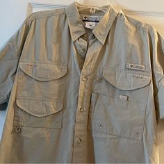 Men’s Columbia Short Sleeve Button Down In A Size M.. Like Brand New!! Khaki Outdoor Shirt With Button Closure, Outdoor Button-up Camp Shirt With Pockets, Collared Shirt With Snap Buttons For Outdoor, Columbia Shirt, Star Buttons, Short Sleeve Button, Casual Shirts For Men, Casual Button Down Shirts, Short Sleeve Shirt