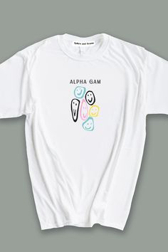 a white t - shirt with the words alphia phi and two faces on it