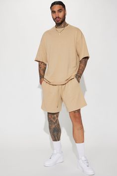 Model Height: 6'4 - Wearing Large Big & Tall: Height 6'5 - Wearing XXXL Available In Tan. Crew Neck Short Sleeve 60% Cotton, 40% Polyester Imported | Mens I Like How It Looks Oversized Terry Short Sleeve Tee Shirt in Tan size 3XL by Fashion Nova Relaxed Fit T-shirt With Drop Shoulder For Loungewear, Relaxed Fit Loungewear T-shirt With Drop Shoulder, Relaxed Fit Drop Shoulder Loungewear T-shirt, Casual Beige Tops For Loungewear, Beige Cotton Shirt For Loungewear, Oversized Short Sleeve Loungewear Shirt, Relaxed Fit Shirt For Loungewear, Casual Solid Color Shirt For Loungewear, Oversized Short Sleeve Shirt For Loungewear