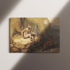 a painting hanging on the wall next to a dog and a man sitting on a rock