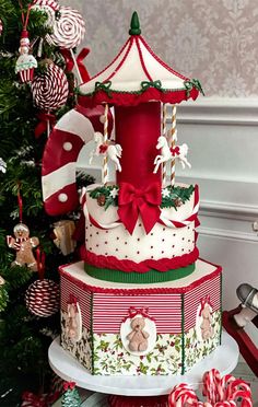 a three tiered christmas cake decorated with candy canes