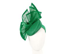 This exclusive fascinator is made right here, in Melbourne, by our experienced milliners. Classic green pillbox base with hand-crafted silk abaca arrangement. It will be a highlight of your spring racing outfit.  Made in Australia  Comfortable headband  Bespoke design Green Fitted Fascinator For Races, Fitted Green Fascinator For Races, Green Adjustable Fascinator For Formal Occasions, Spring Green Fascinator For Races, Green Fascinator For Summer Evenings, Green Summer Fascinator For Formal Occasions, Green Evening Fascinator For Summer, Green Formal Headpiece For Kentucky Derby, Green Spring Evening Fascinator