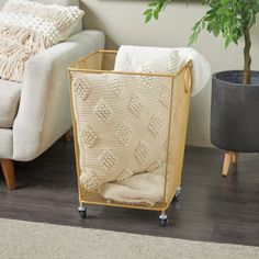 a living room with a couch, chair and potted plant