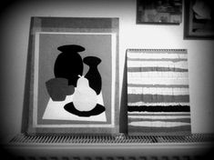 black and white photograph of two paintings on the wall