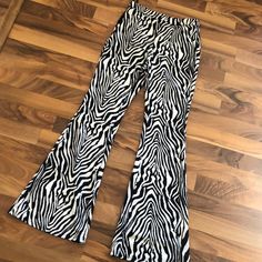 Never Worn Zebra Print Flare Pants. Zipper And Tie Waist. Stretch Zebra Print Bottoms For Summer, Black Zebra Print Bottoms For Spring, Casual Black Zebra Print Pants, Black Zebra Print Pants For Spring, Casual Fitted Bottoms With Zebra Print, Casual Stretch Zebra Print Bottoms, Spring Black Zebra Print Pants, Casual Fitted Zebra Print Bottoms, Trendy White Zebra Print Bottoms