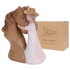 a figurine of a man and woman kissing in front of a box