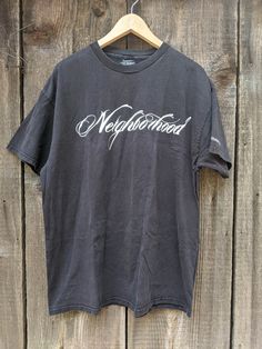 A classic and rare vintage skate tee. Features nicely distressed black cotton, the 'Neighborhood' logo front & center, small Stussy graphic on the left sleeve, a comfy oversize fit, and lots of retro streetwear chic. A cool collectible and great gift. Brand : STUSSY Neighborhood 'Boneyards' 100% cotton Made in Mexico of US components Labeled size XL (I'd say Men's XL, Ladies' 2XL) All measurements taken with garment lying flat, double where necessary 23 inches shoulder seam to shoulder seam 23.5 Relaxed Fit Grunge T-shirt For Streetwear, Grunge Relaxed Fit T-shirt For Streetwear, Washed Black Graffiti Print Top For Streetwear, Grunge T-shirt With Screen Print For Skateboarding, Grunge Graphic Print T-shirt For Skateboarding, Grunge Graphic T-shirt For Skateboarding, Graffiti Print Short Sleeve T-shirt For Skateboarding, Short Sleeve T-shirt With Graffiti Print For Skateboarding, Washed Black Cotton T-shirt With Graffiti Print