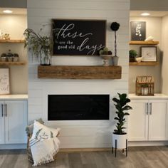 a living room filled with furniture and a fire place under a sign that reads these days