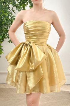 Corset Strapless Light Gold Dress with Bow Elegant Strapless Prom Dress With Bow Tie Back, Elegant Evening Strapless Dress With Detachable Bow, Strapless Gala Dress With Detachable Bow, Elegant Strapless Dress With Bow Tie Back For Prom, Elegant Strapless Dress With Bow Tie Back For Cocktail, Evening Strapless Satin Dress With Bow, Strapless Dress With Bow Tie Back For Gala, Strapless Party Dress With Detachable Bow, Glamorous Strapless Dress With Bow Tie Back