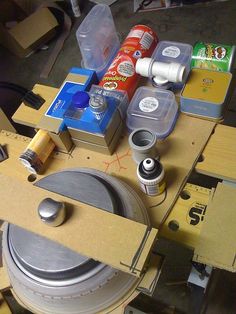 various items are sitting on top of a table with tape and other crafting supplies