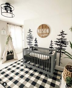 a baby's room decorated in black and white