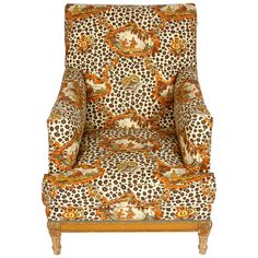 an upholstered chair with leopard print on it