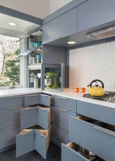 a kitchen that has some drawers in it