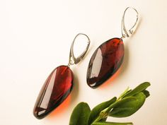 Small dark red amber earrings with silver sparkly burgundy | Etsy Modern Garnet Jewelry For Gift, Modern Garnet Jewelry As A Gift, Handmade Burgundy Earrings For Gift, Elegant Baltic Amber Jewelry For Formal Occasions, Elegant Formal Baltic Amber Jewelry, Handmade Elegant Baltic Amber Earrings, Elegant Handmade Baltic Amber Earrings, Classic Amber Earrings For Gift, Baltic Amber Teardrop Earrings As Gift