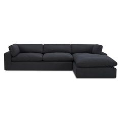 a black sectional couch sitting on top of a white floor