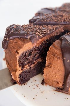 a piece of chocolate cake on a plate with a fork