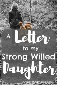 a woman standing next to a sign that says, a letter to my strong willed daughter