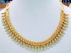 "Vintage 22 karat solid gold spiky design necklace(champakalee har) with earring pair from rajasthan india. made of solid 22 karat gold and sated ruby color stones. full handcrafted great piece for your jewelry collection. buyer will get gold test report for this item for free. total weight of set-66 grams(2.31 ounce), total lenght of necklace-18\"(we can adjust length),width of necklace-1\",material -solid 22 karat gold." Dual-tone 22k Gold Jewelry For Festivals, Yellow Gold Dual-tone Jewelry For Festivals, Yellow Gold Ruby Temple Necklace For Celebration, Formal Hallmarked Temple Necklace For Festivals, Gold Temple Necklace With Round Ruby, Gold Temple Necklace With Ruby, Ruby Temple Necklace In Yellow Gold Gift, Gift Ruby Temple Necklace In Yellow Gold, Yellow Gold Ruby Temple Necklace Gift