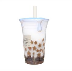 a plastic cup filled with brown and white liquid